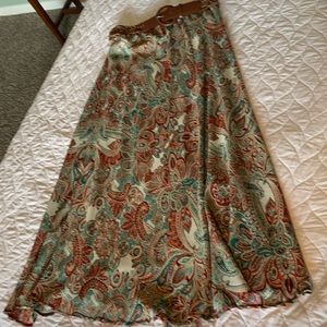 Paisley printed long skirt, lined with belt. Small